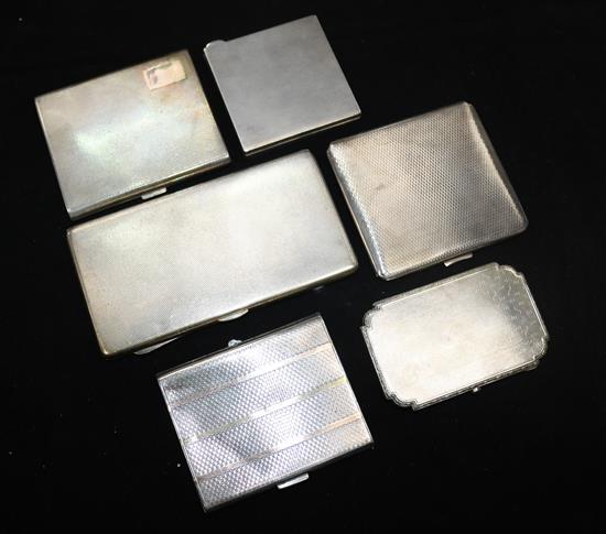 A silver combined cigarette and match book case and five small silver engine-turned cigarette cases